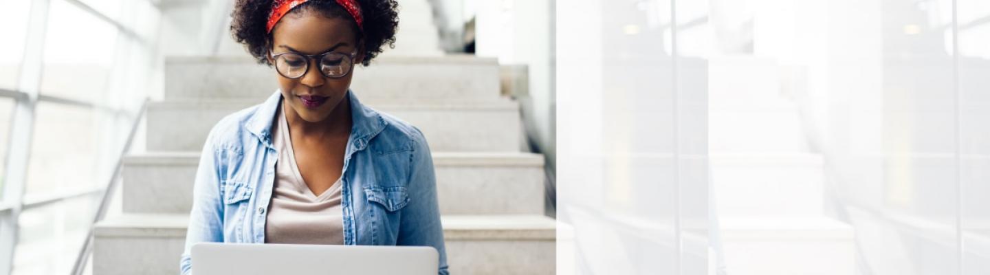 Young Woman looking at her laptop