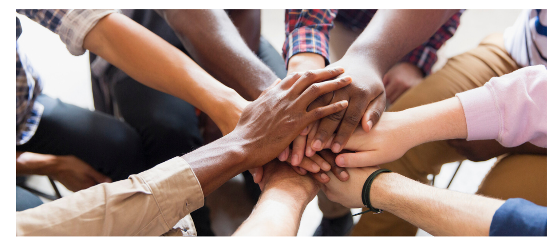 individuals holding hands