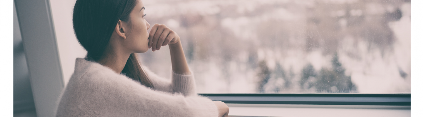 person looking out window