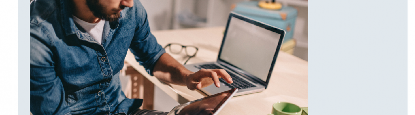 individual using a tablet at desk